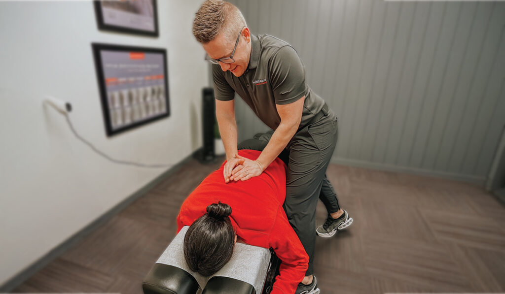 Dr. Kurt Slonaker providing a chiropractic adjustment to a patient at HealthSource of Meridian